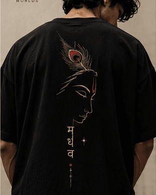 Back of the black MADHAV tee: a serene portrait in profile, crowned with a peacock feather